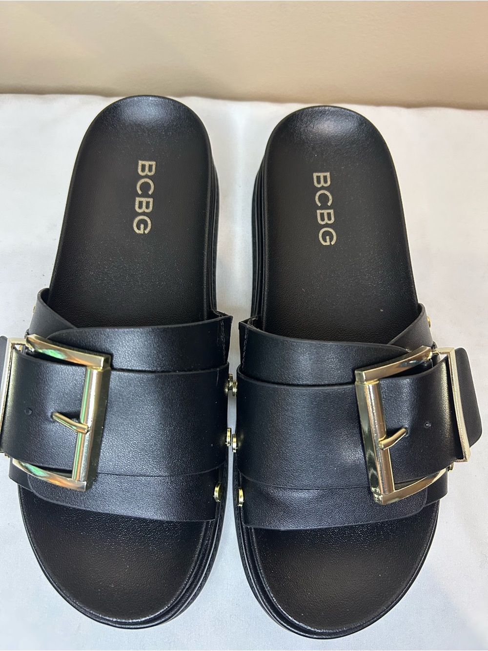 BCBG Black Slide Sandals with Gold Buckles